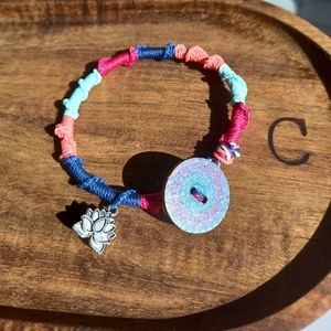 Brand new handmade Brazilian waxed string bracelet with lotus charm.
